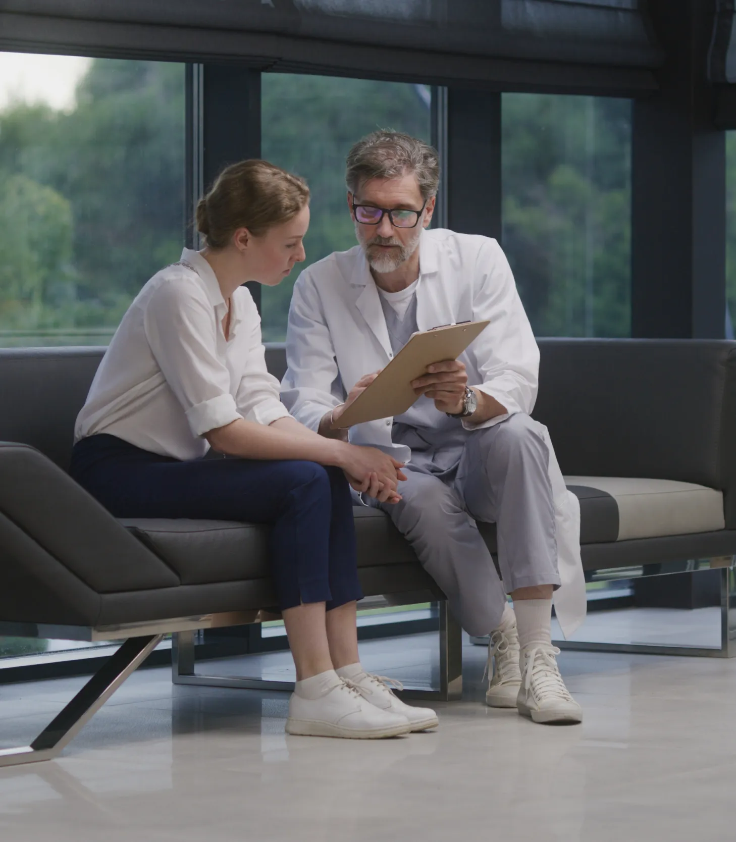 Healthcare consultant reviewing growth strategy and performance planning with a medical practice leader